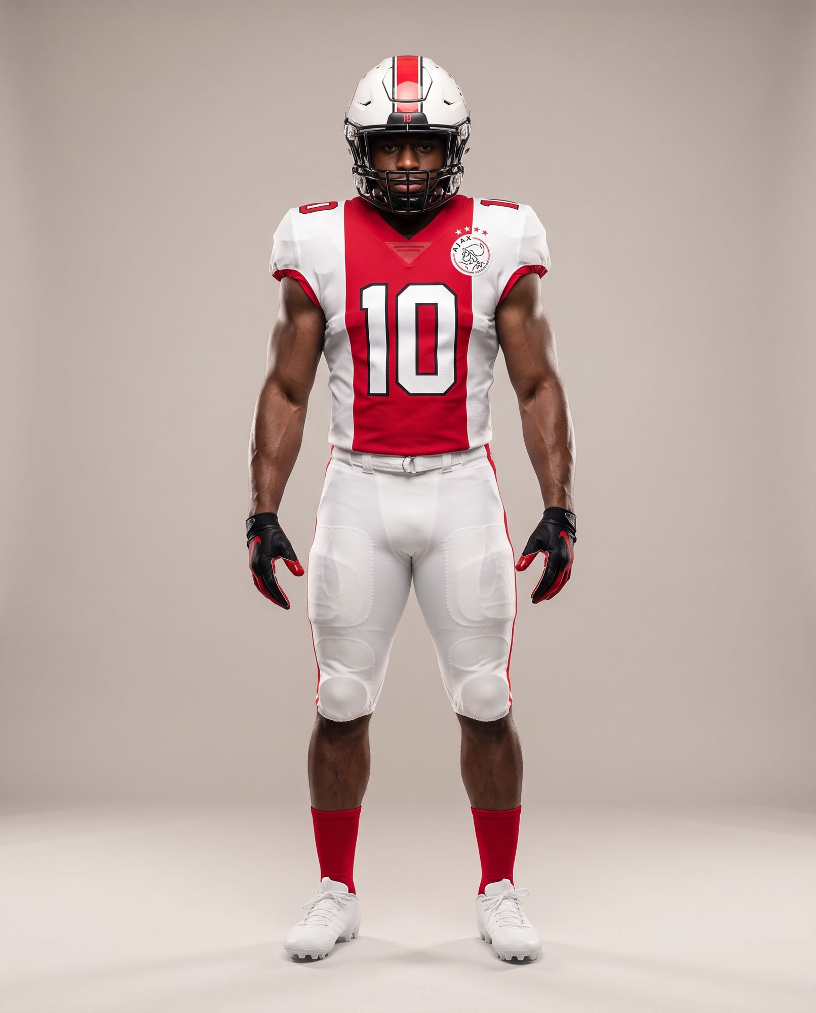 Ajax running back in the white home uniform with the wide red centre band, number 10 and the crest on the chest