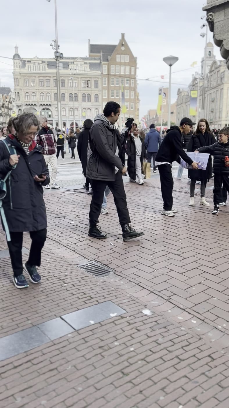A crowd gathering around the Candy Bites giveaway on Dam Square