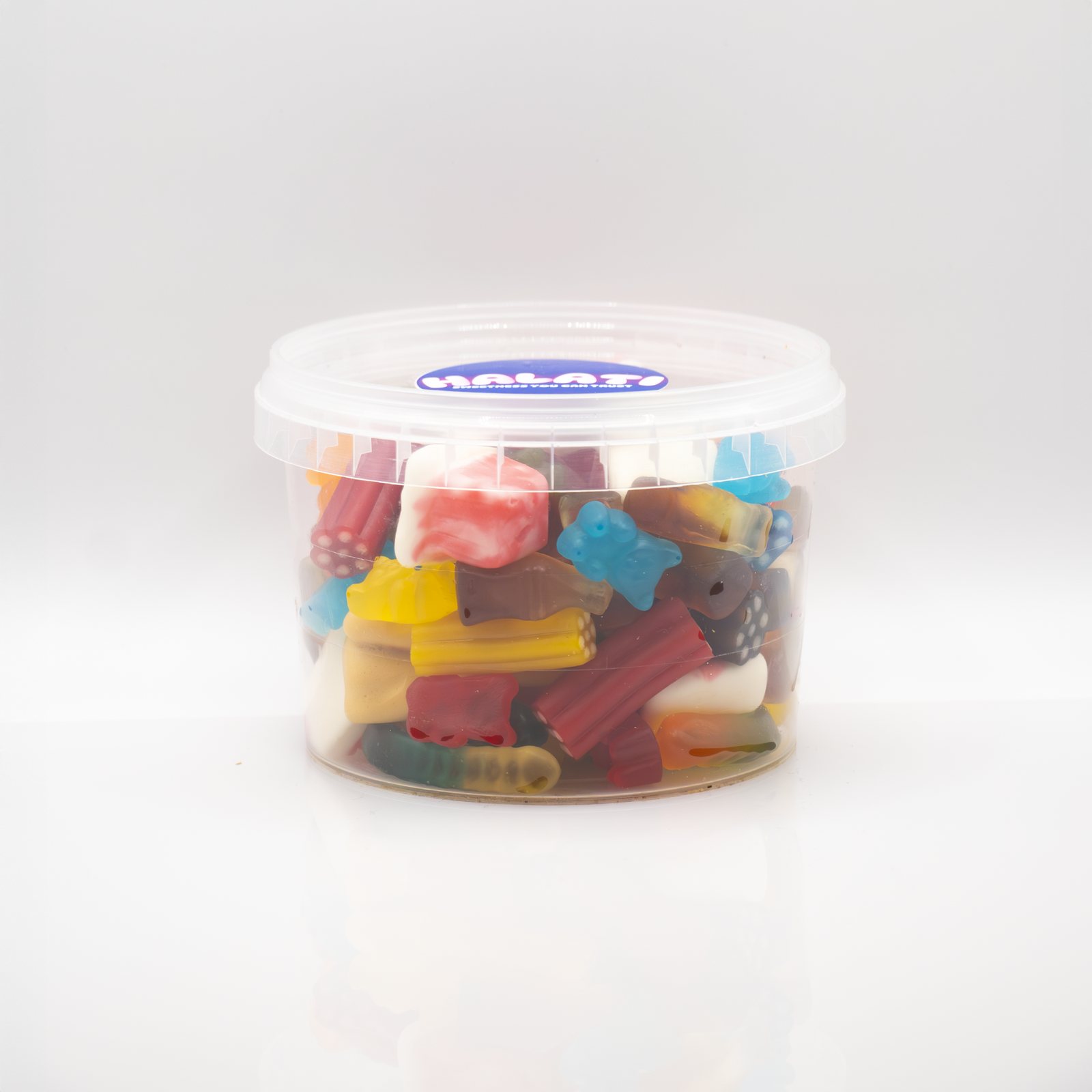 HALATI candy tub with a mixed selection of sour candies on a white sweep