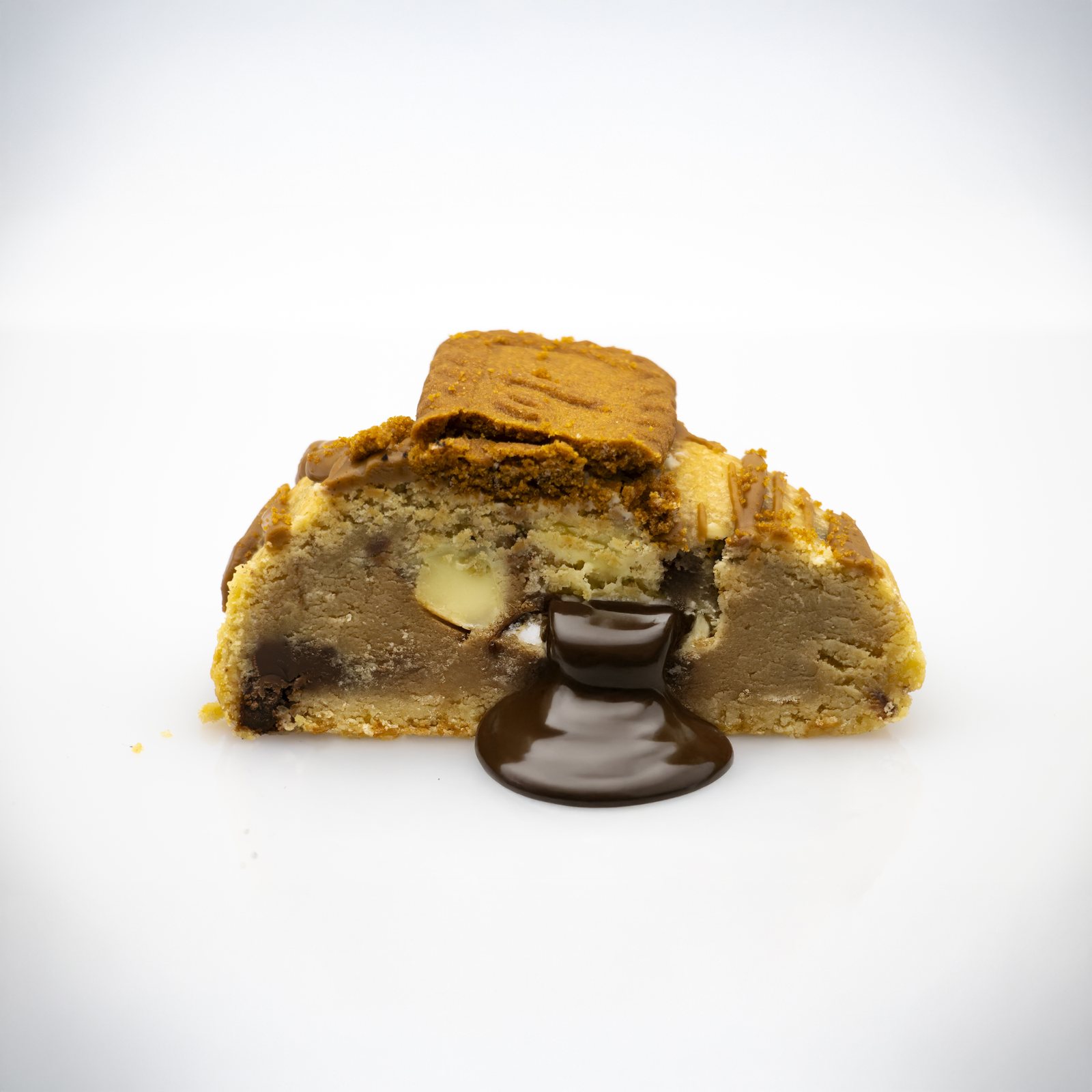 Lotus cookie broken open with melted chocolate pouring out